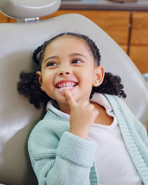 Girl smiling during dental exam